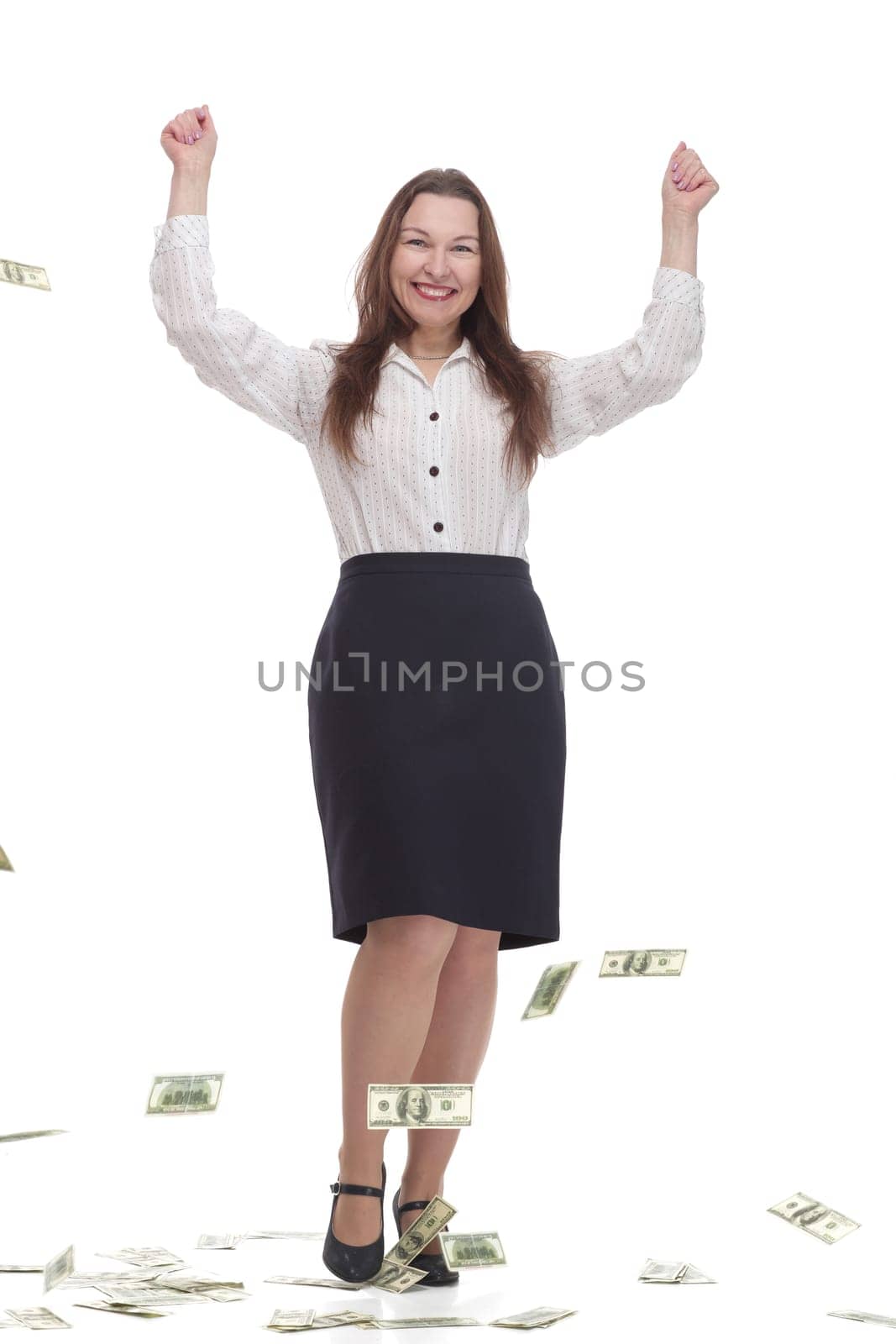 in full growth. happy business woman with banknotes. isolated on a white background.