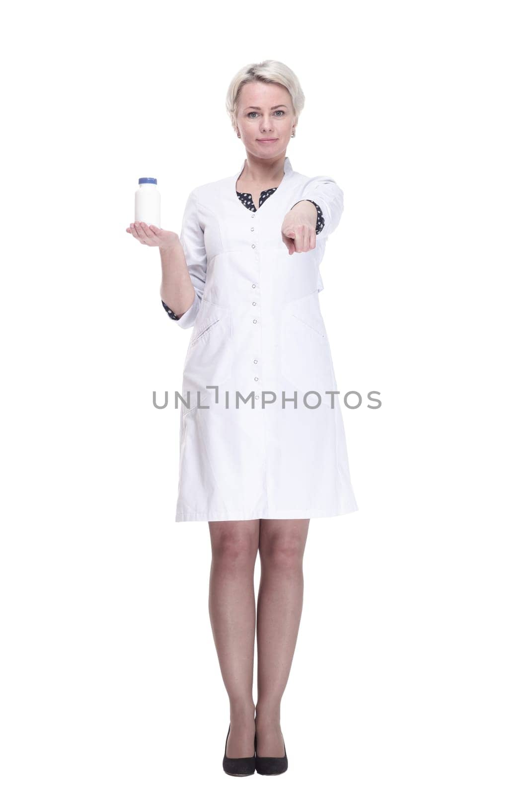 in full growth. female doctor holds a bottle of sanitizer. isolated on a white background.