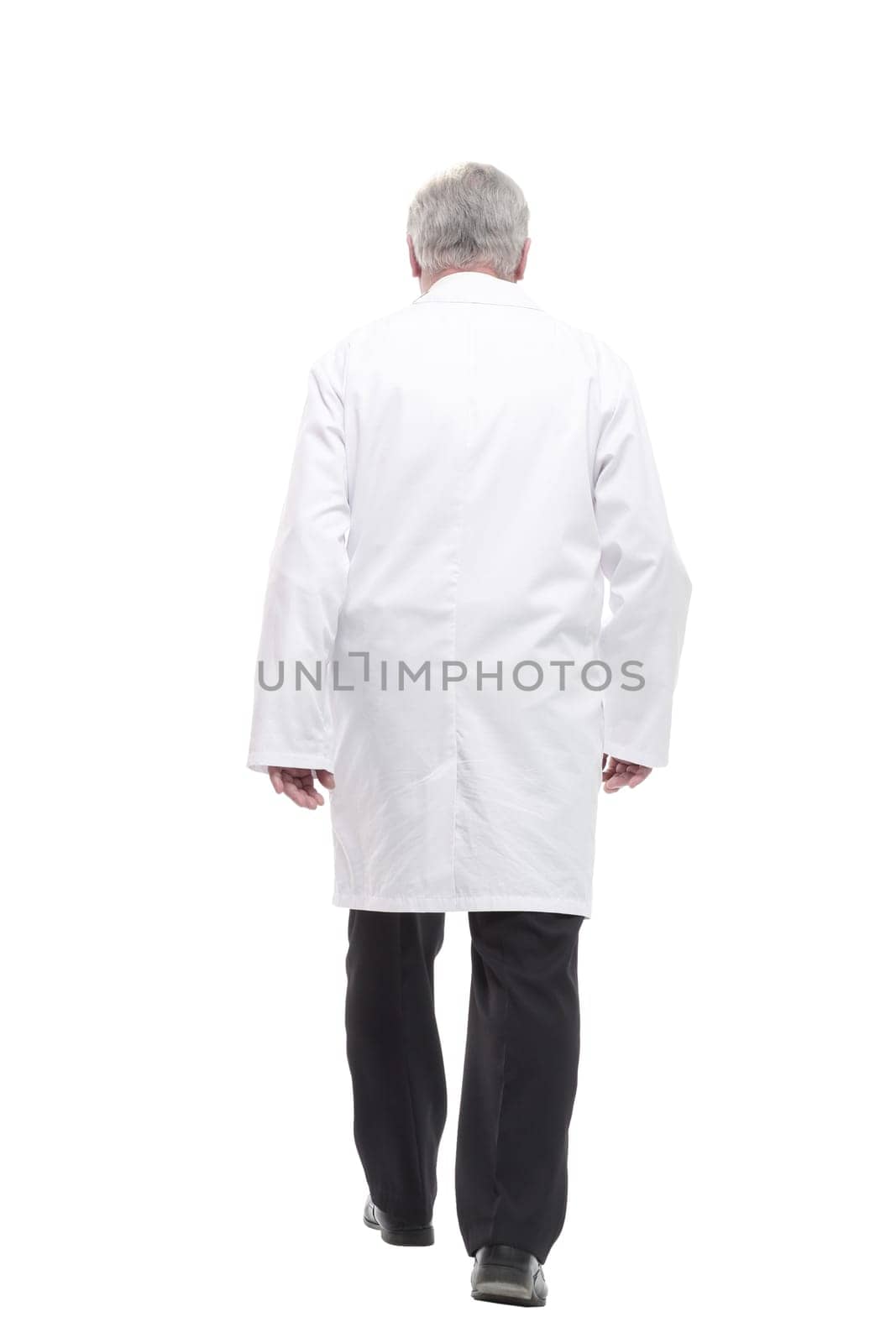 qualified mature doctor with stethoscope stepping forward. isolated on a white background.