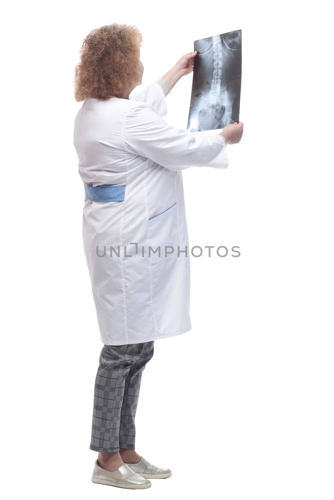 full-length. senior female doctor with x-ray. isolated on a white background.