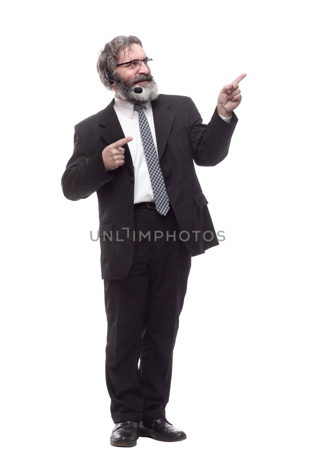 in full growth. business man with a headset. isolated on a white background