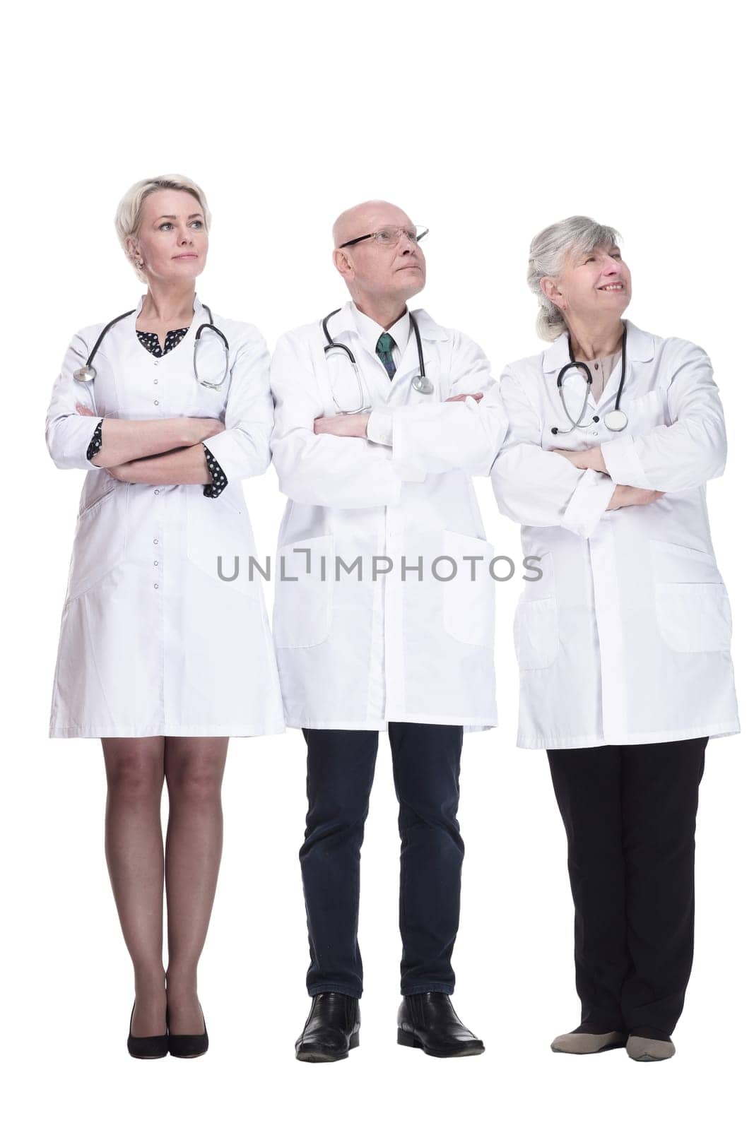 experienced doctors colleagues standing together. isolated on a white background. by asdf