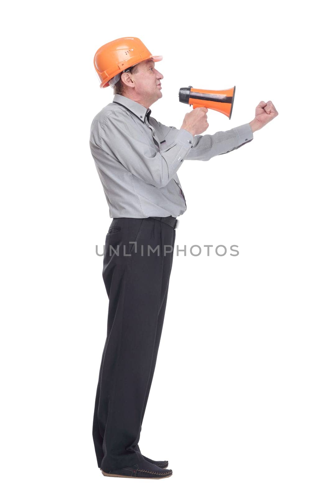 side view. senior architect making an announcement via megaphone . isolated on a white background.