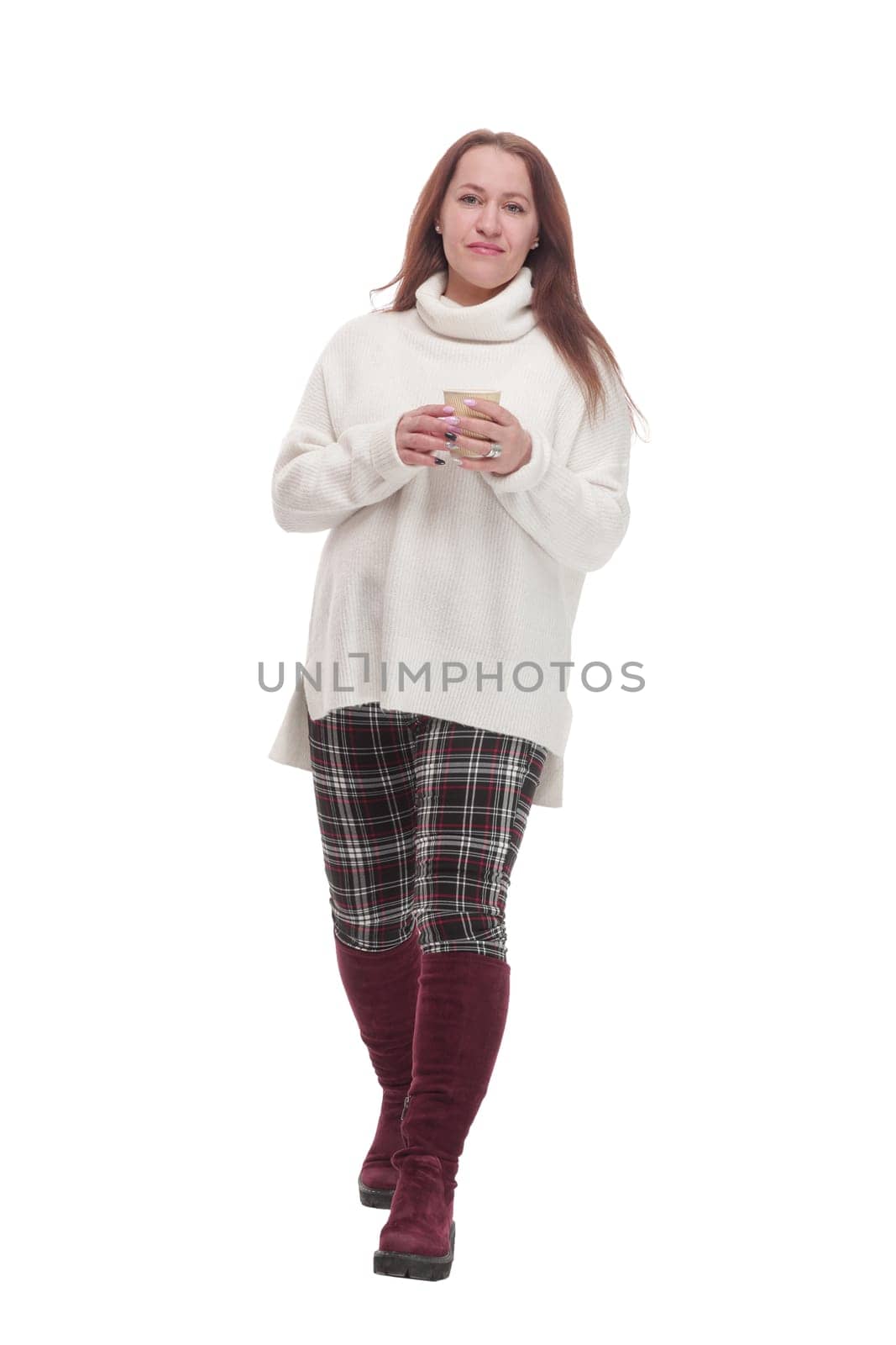 in full growth. casual attractive woman with takeaway coffee.isolated on a white background.