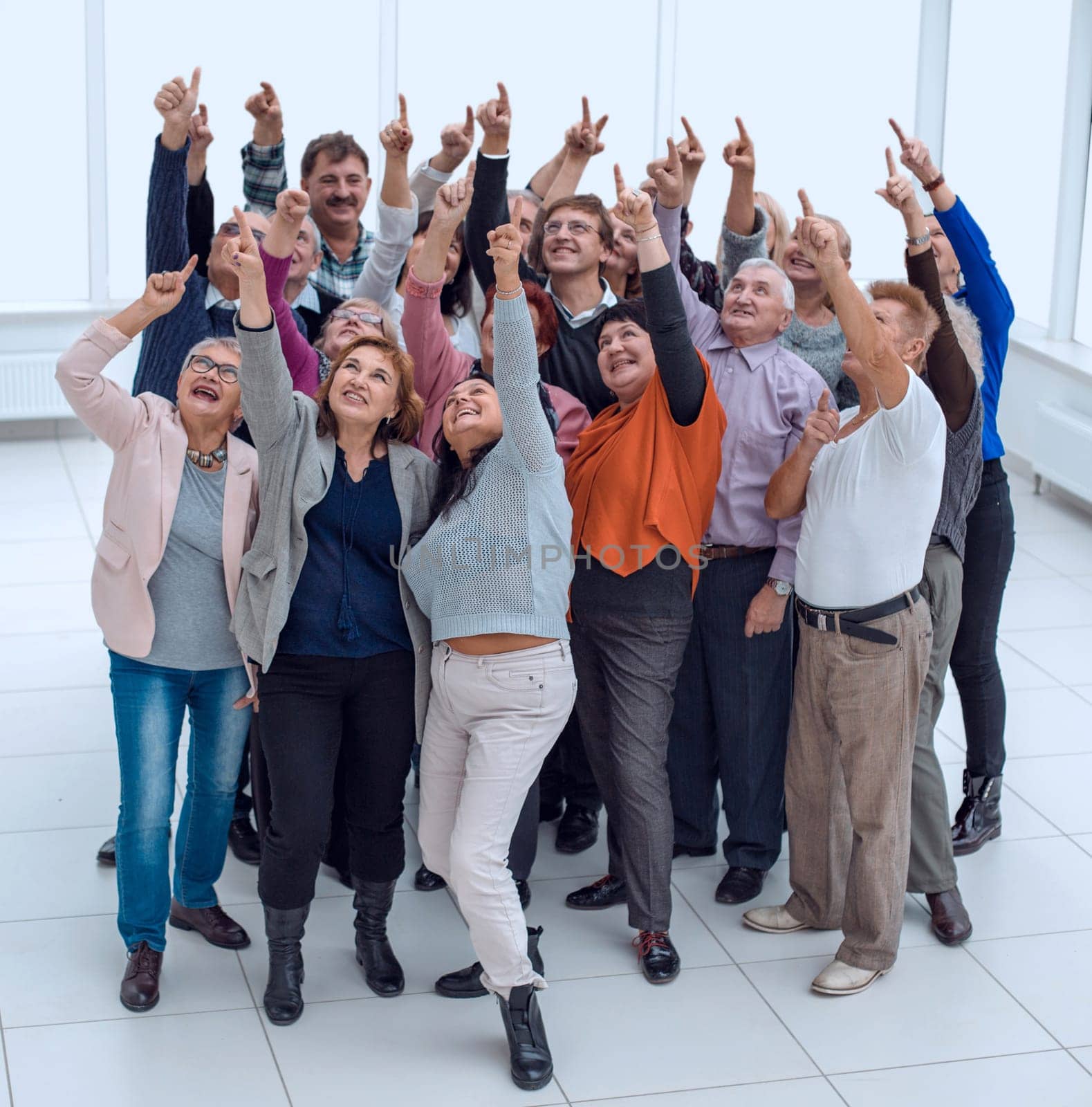 a group of older people raised their hands trying to reach by asdf