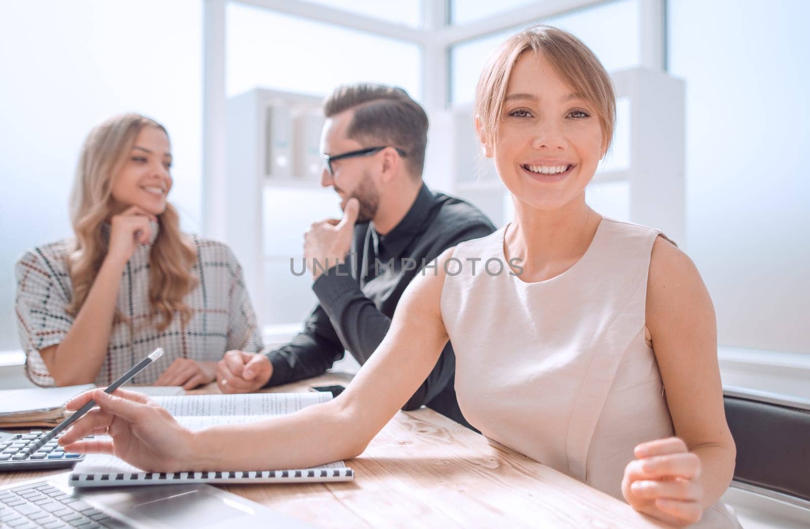 young business woman sitting at Desk in office. photo with space for text