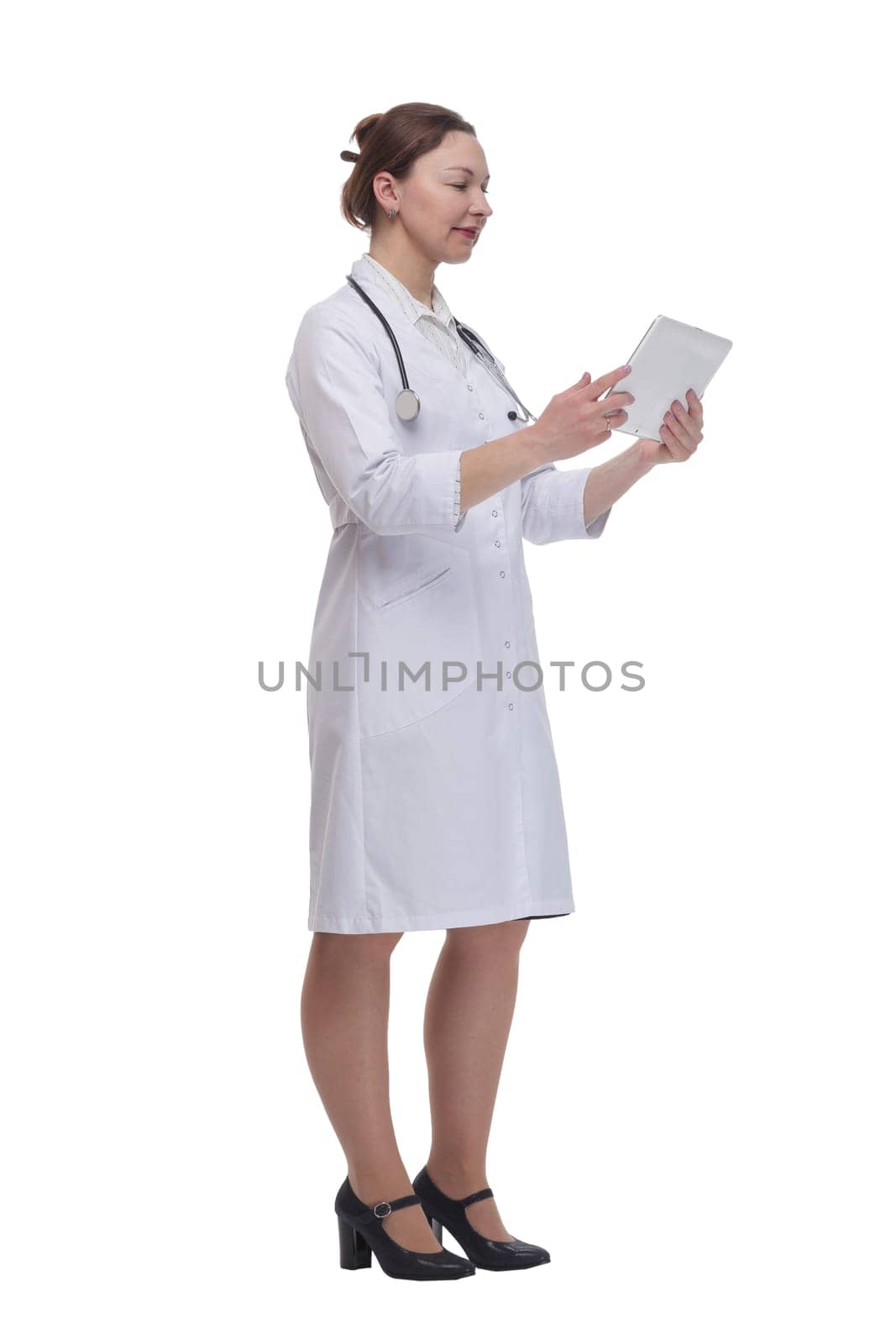 in full growth.female doctor with a digital tablet. isolated on a white background.