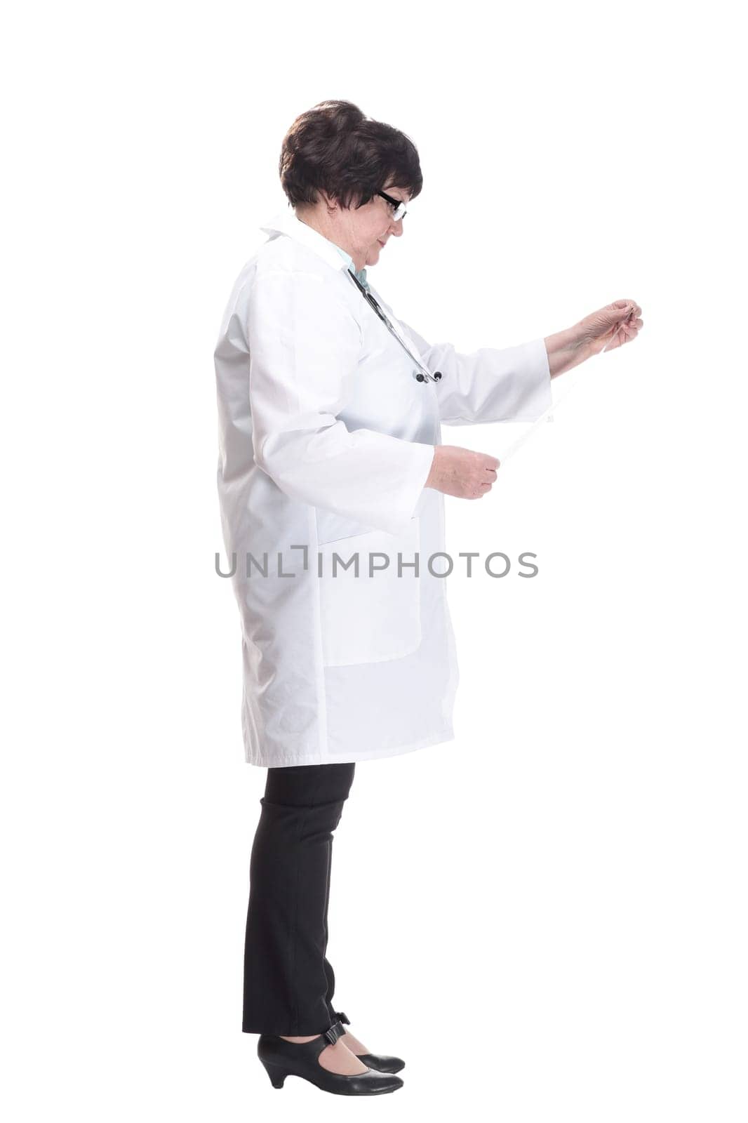 in full growth. senior female doctor with an x-ray. isolated on a white background.