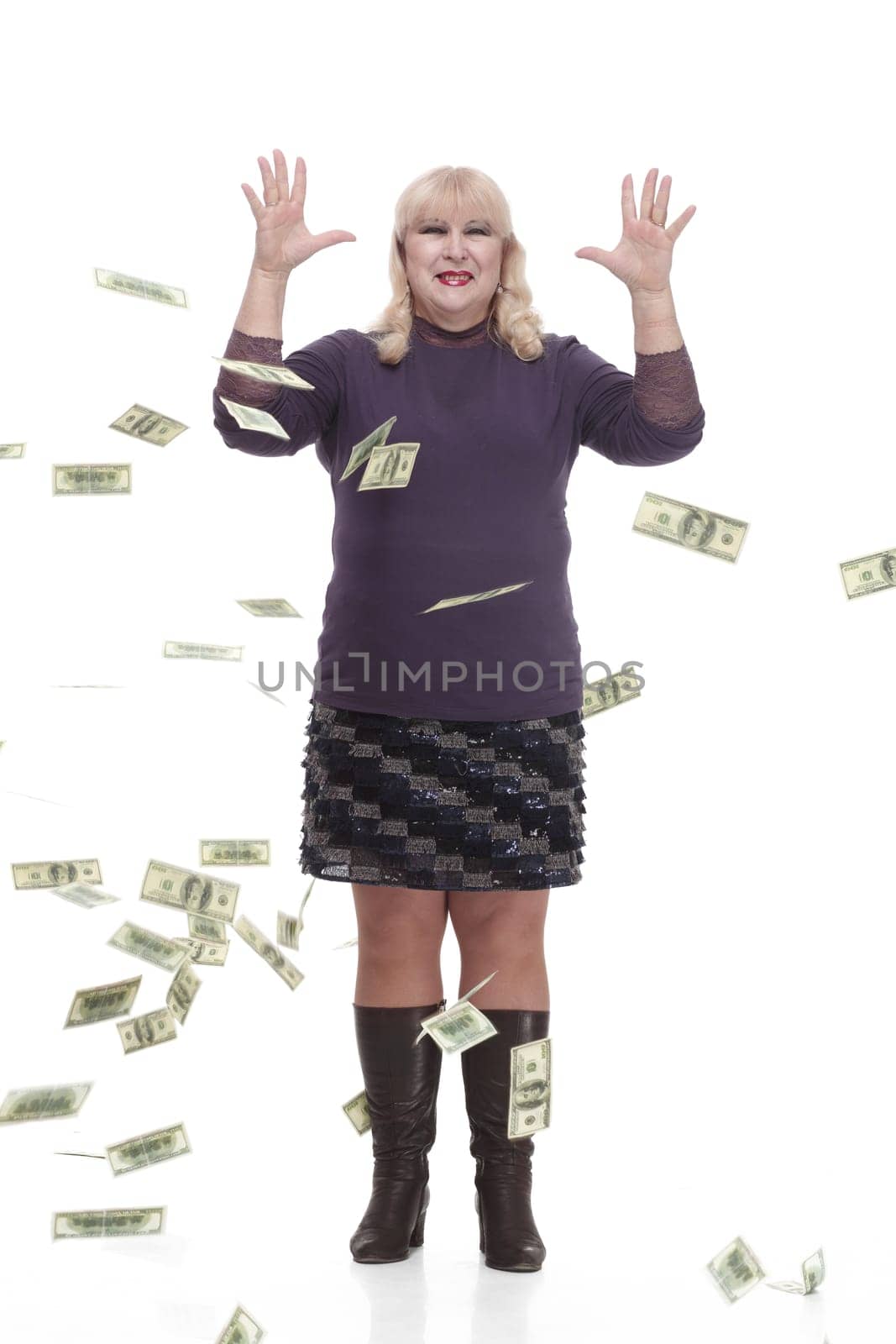 full-length.casual mature woman with banknotes . isolated on a white background.
