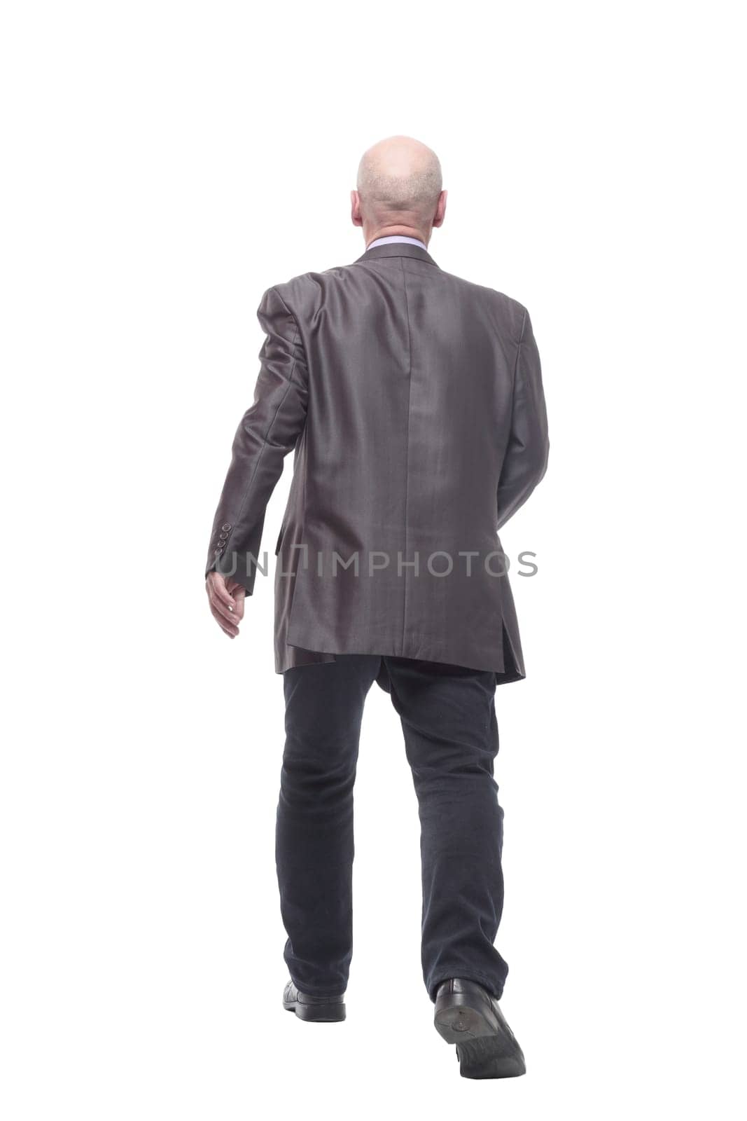 in full growth. Executive business man striding forward . isolated on a white background.