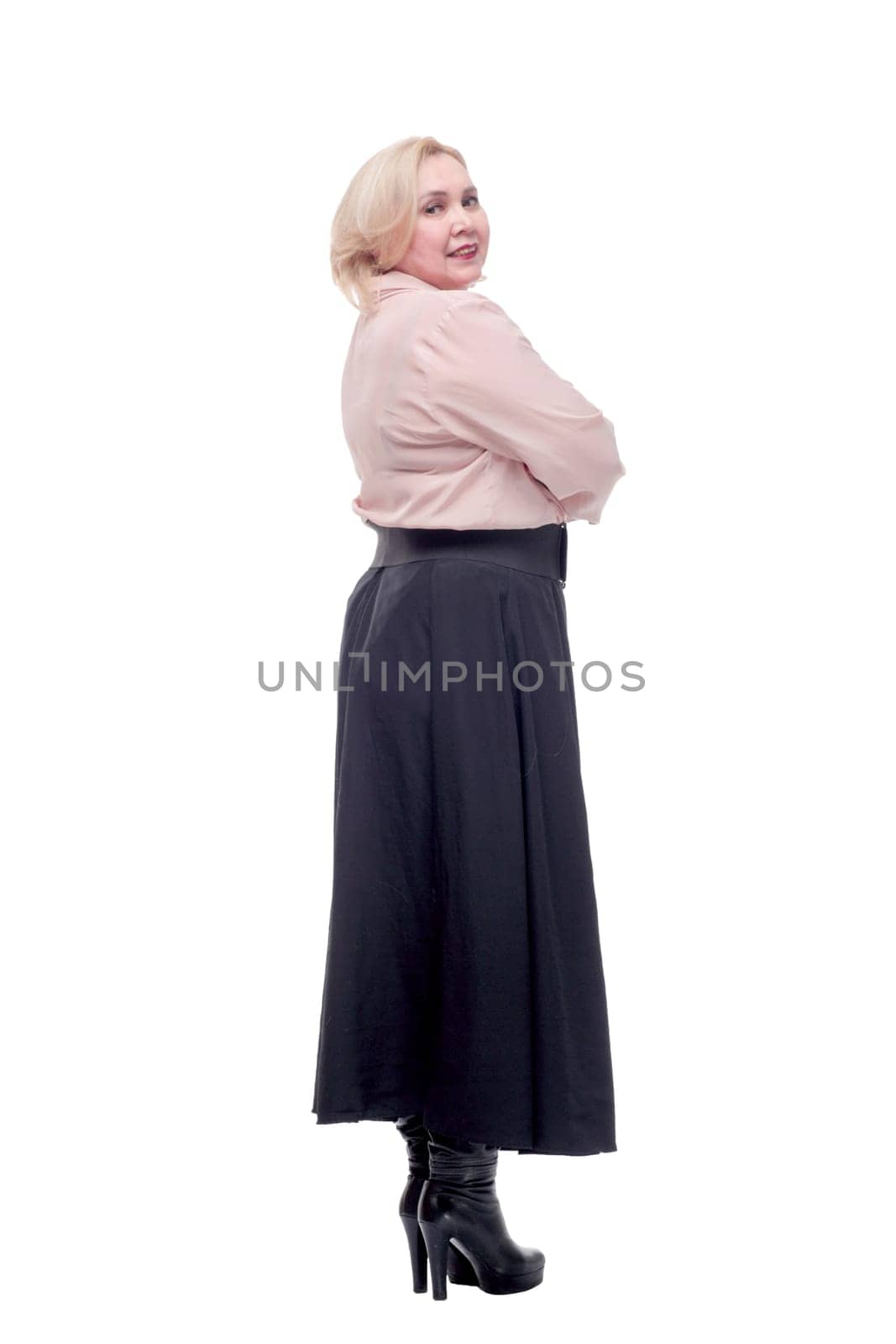 Back view of beautiful blonde woman looking at something wearing pink blouse