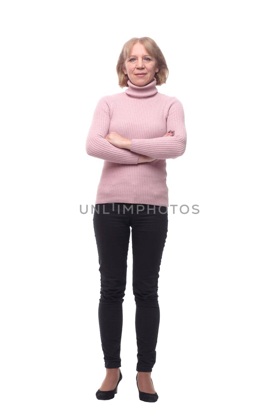 Full length portrait of a happy woman standing isolated over white background and looking at camera