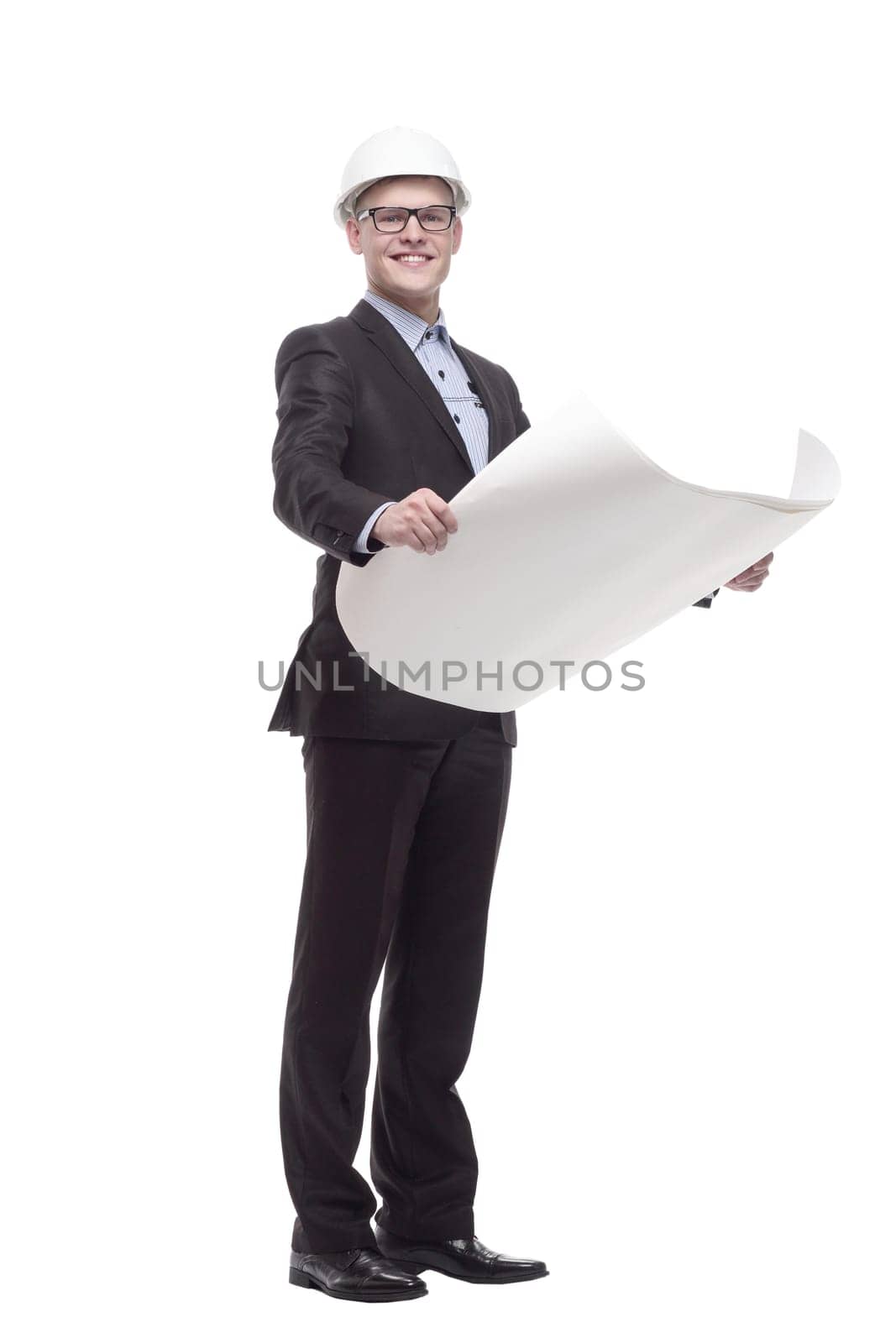 in full growth. young architect with drawings. isolated on a white background.