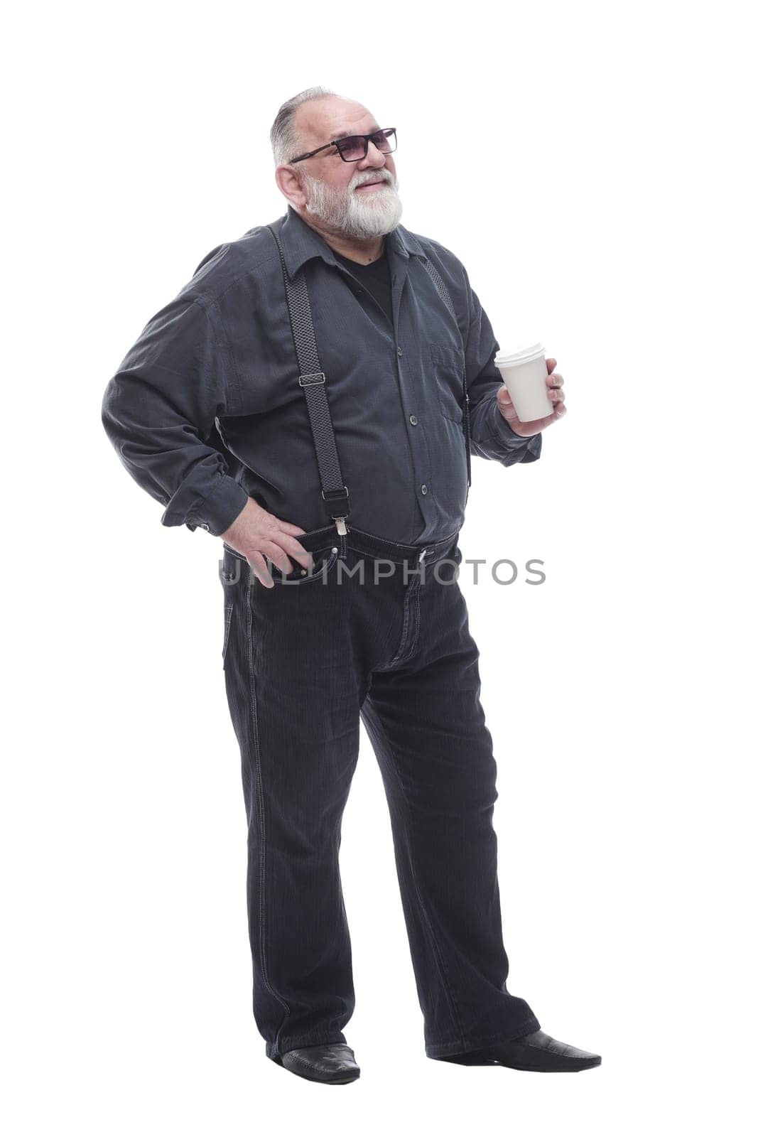 full- length . a successful older man drinks takeaway coffee. isolated on a white background.