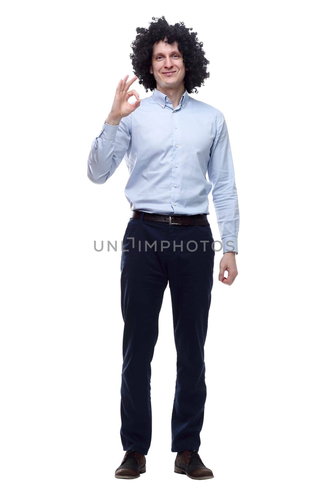 in full growth. confident curly-haired man . isolated on a white background