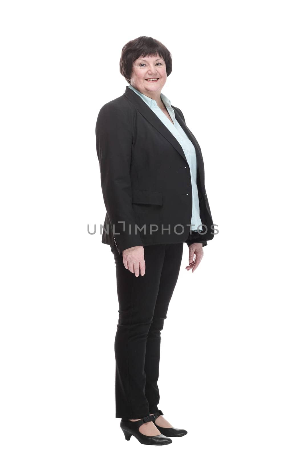 Mature business woman in a black pantsuit . isolated on a white background.