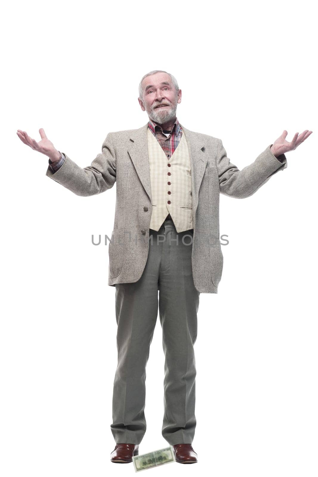 in full growth. elderly business man with banknotes . isolated on a white background.