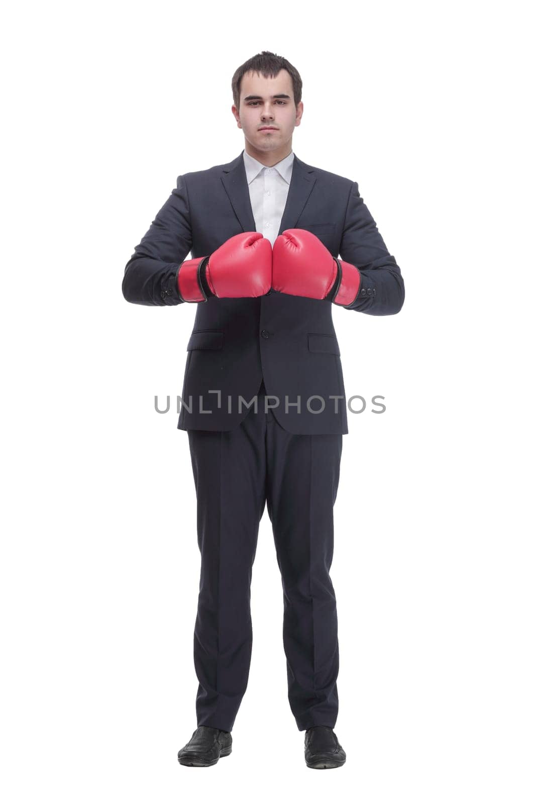 Side view portrait of curious and smiling businessman with tablet looking and pointing to side while standing on white background