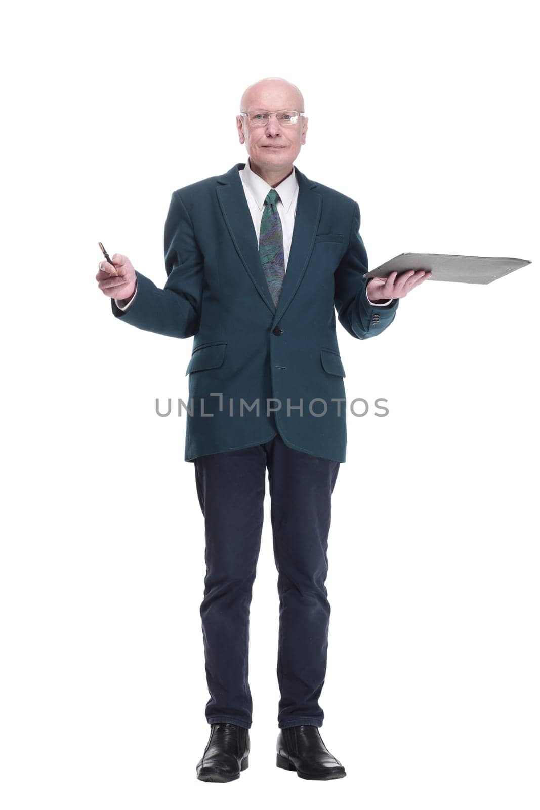 in full growth. serious business man with glasses taking notes on the clipboard. isolated on a white background.