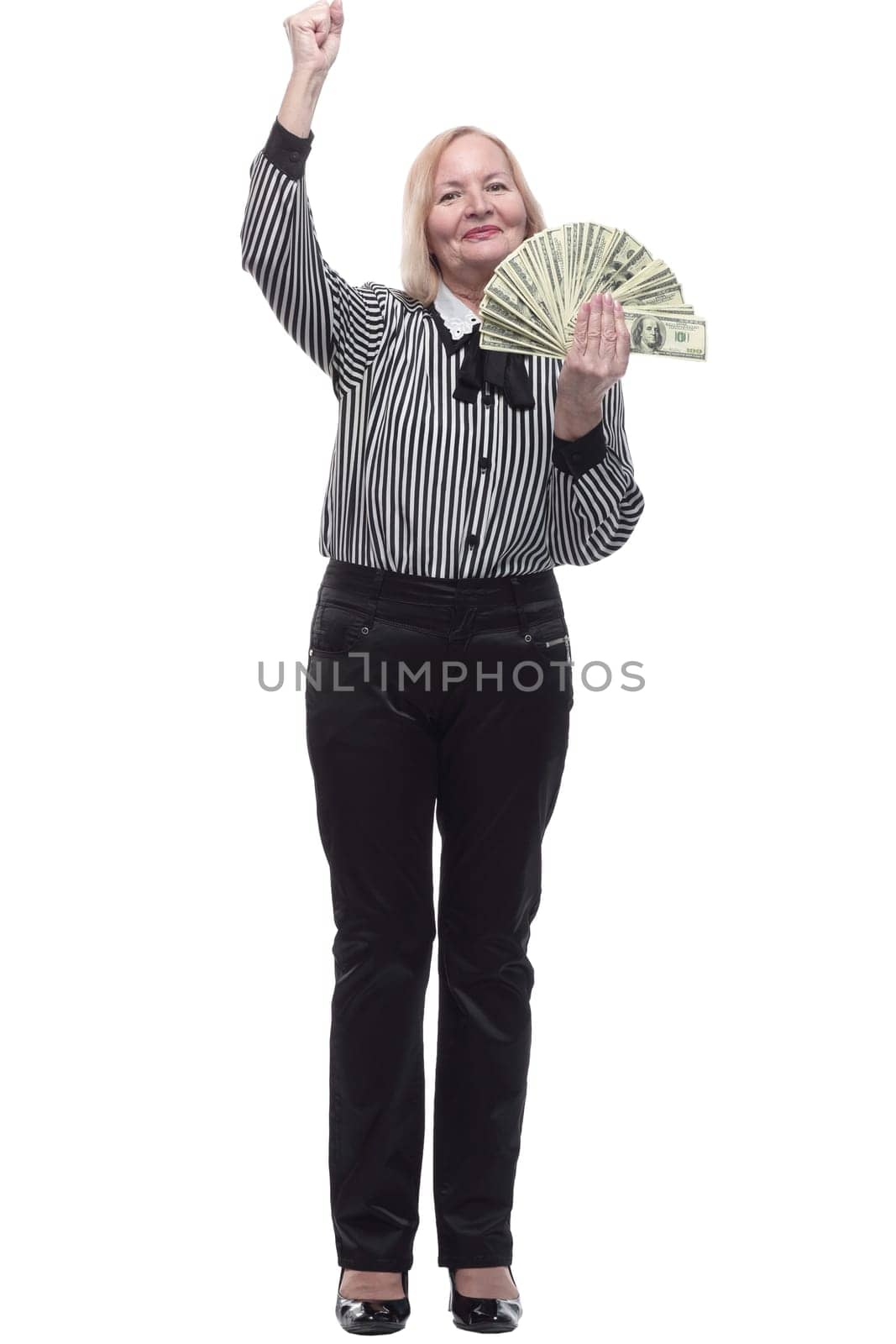 in full growth. attractive business woman with a fan of banknotes. isolated on a white background.