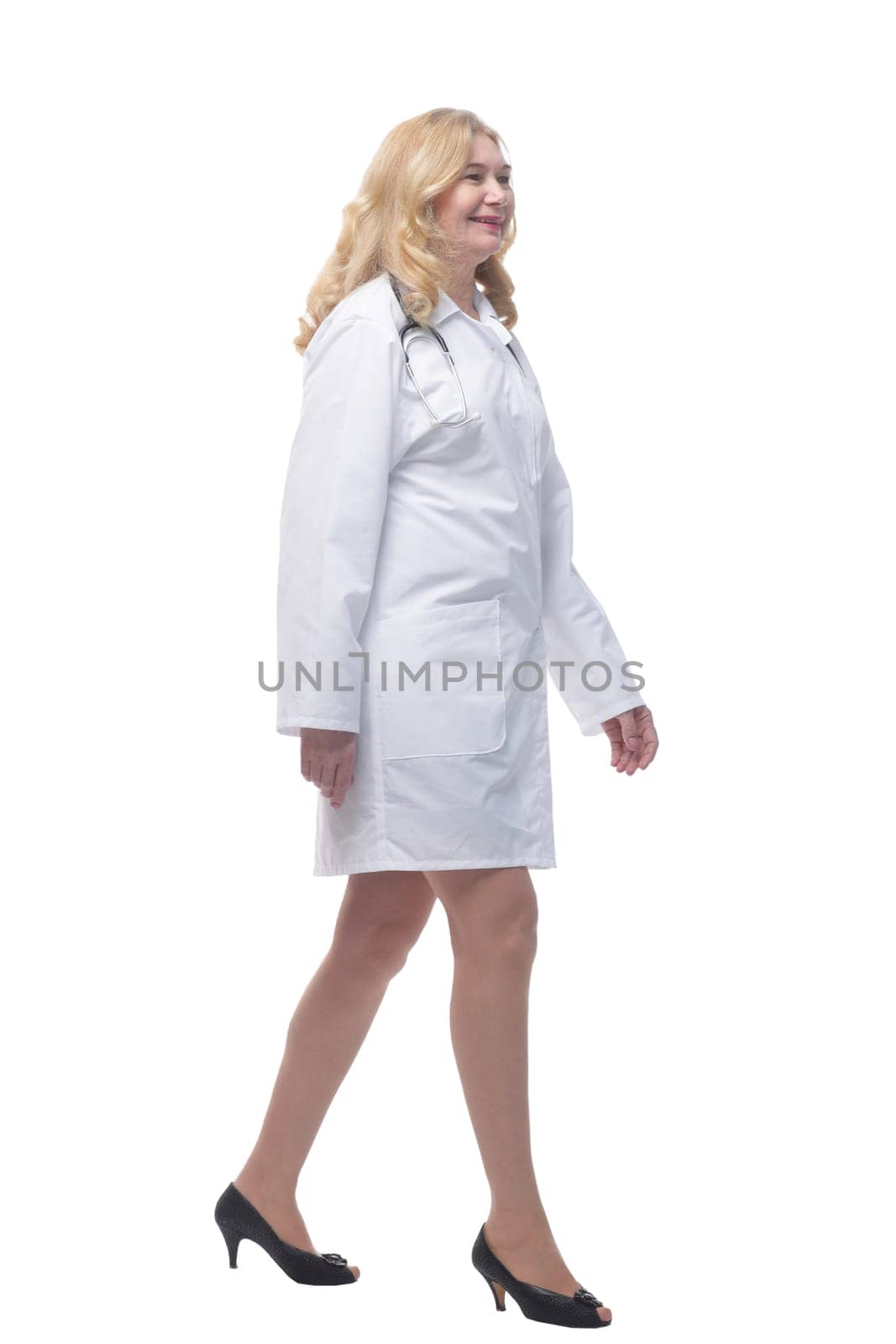 full length . successful woman doctor stepping forward . isolated on white background.