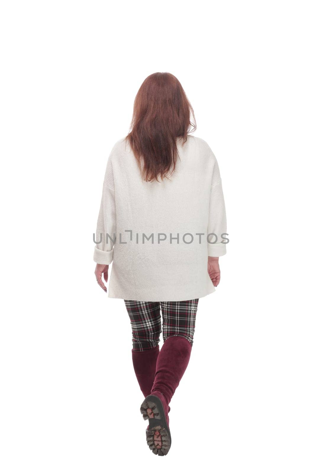 full-length. woman in casual clothes walking forward .isolated on a white background.