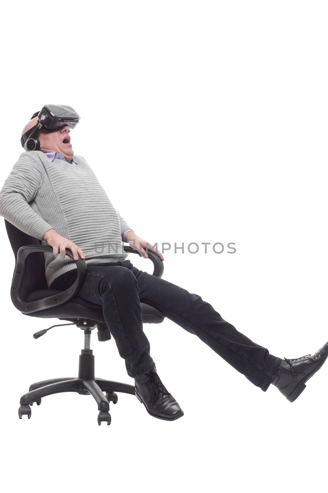 in full growth. smiling man in virtual reality glasses. isolated on a white background.