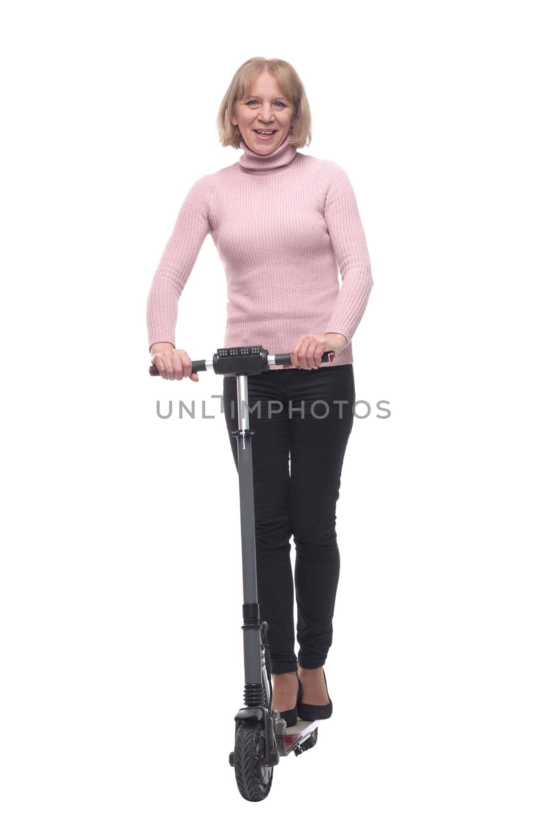 Full length portrait of a woman riding a scooter isolated on white background