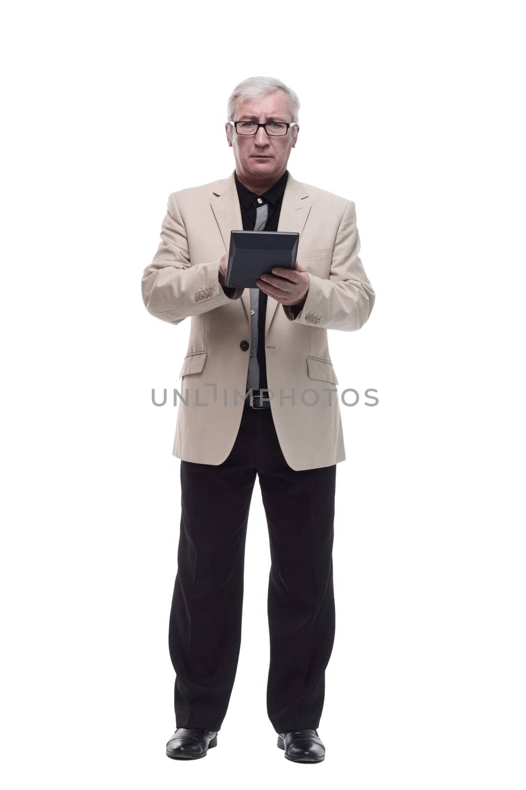 in full growth. Mature intelligent man with a calculator. isolated on a white background.