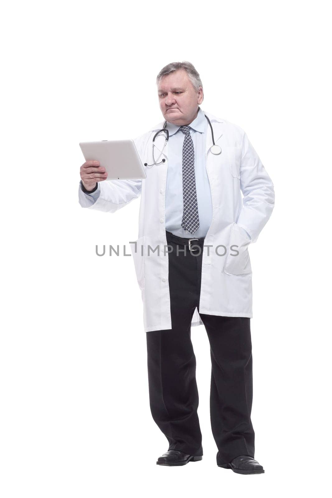in full growth.competent doctor with clipboard. isolated on a white background.