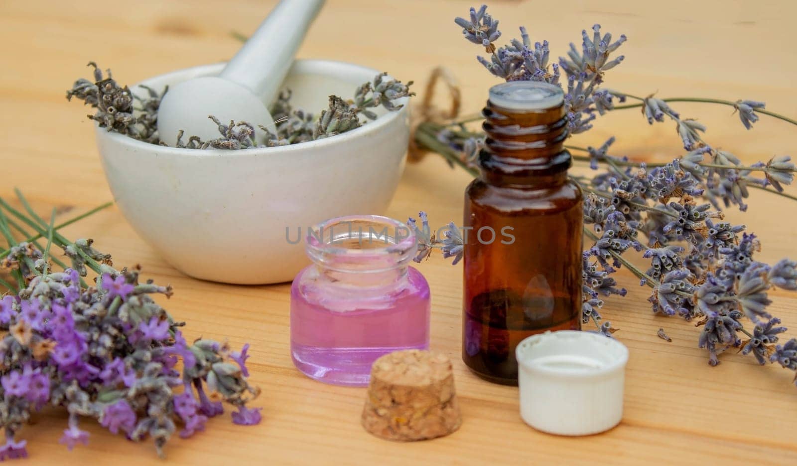 lavender essential oil, on a wooden background. Selective focus. Nature