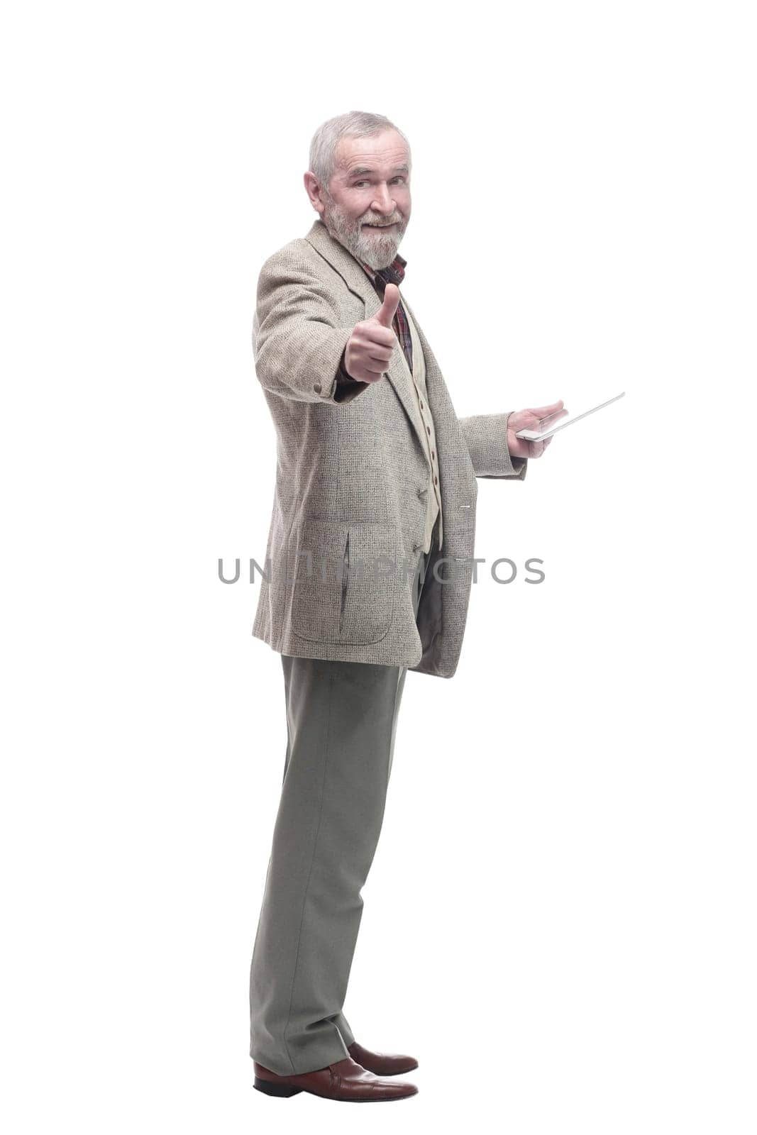 in full growth. elderly business man with a digital tablet. isolated on a white background.