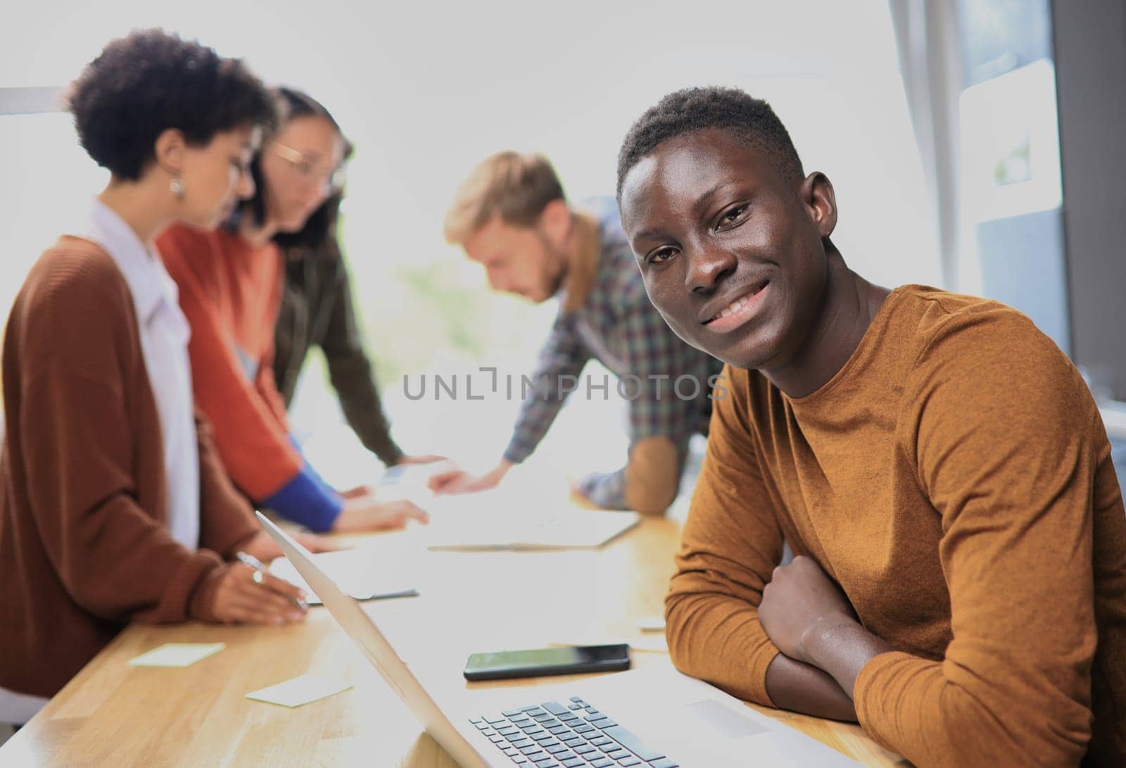 african american businessman working on laptop computer in office