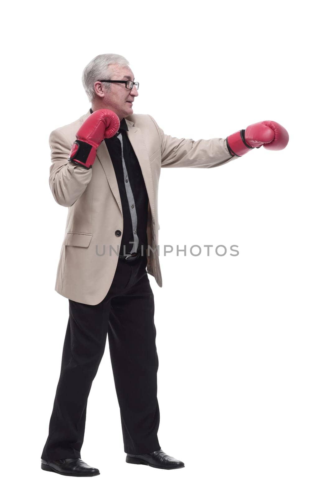 in full growth. Mature, intelligent man in Boxing gloves. isolated on a white background.