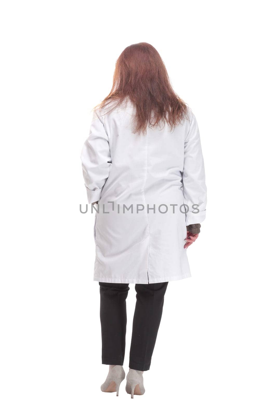 full-length. mature female doctor with stethoscope . isolated on a white background.