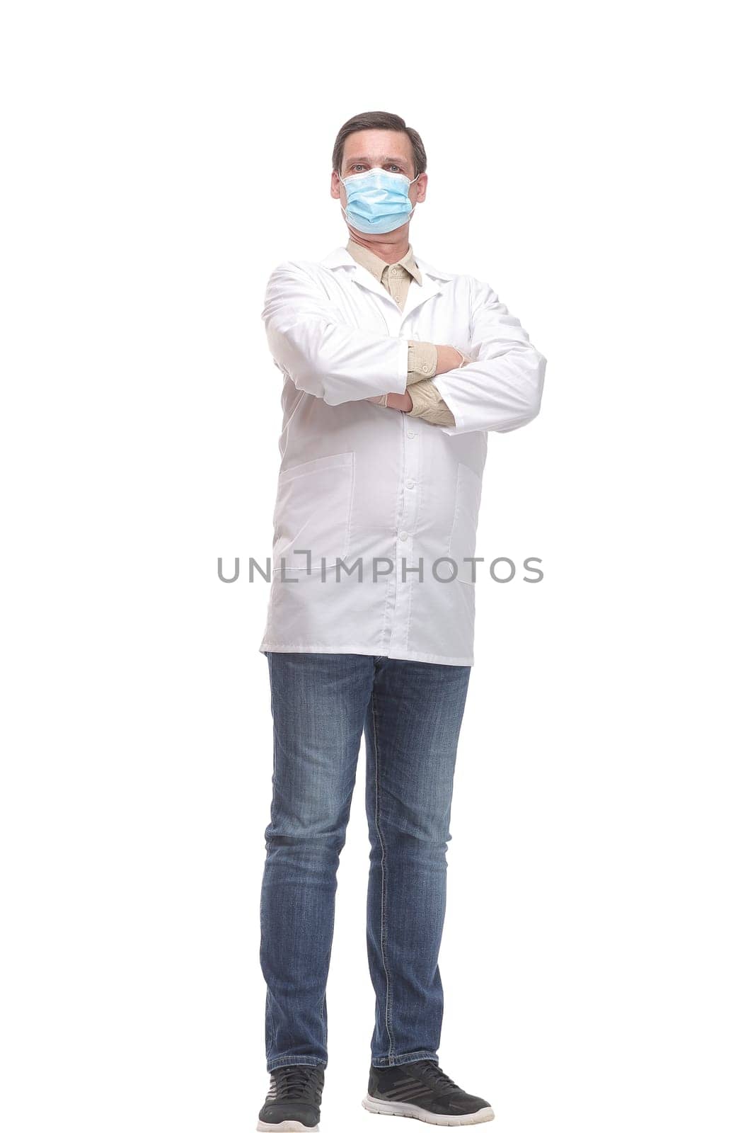 Portrait of caucasian doctor using protective gloves and mask by asdf