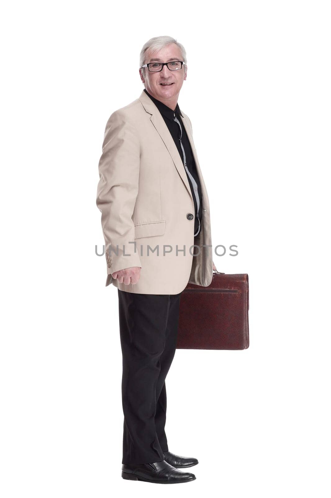 in full growth. intelligent mature man with a leather briefcase . isolated on a white background.
