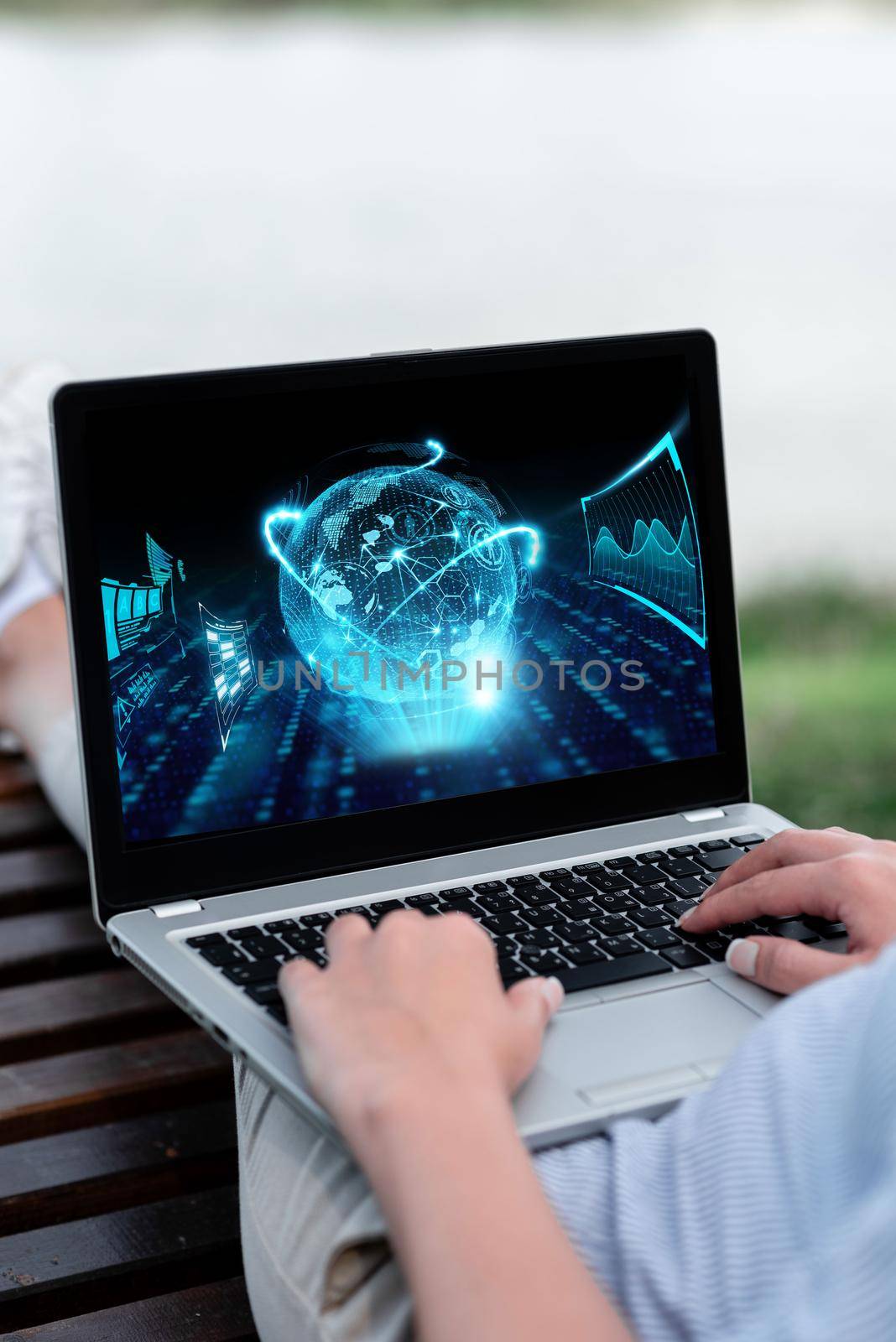 Laptop Resting On Lap Of Woman With Flat Legs Outdoors Accomplishing Her Remote Job. Minicomputer Placed Surface Upper Part Leg Outside Doing Computer Works. by nialowwa