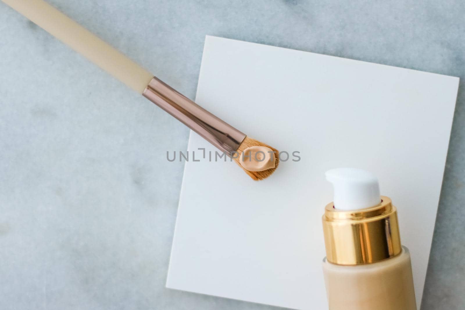 Cosmetic branding, glamour and skincare concept - Makeup foundation bottle and contouring brush on marble, make-up concealer bb cream as cosmetics product for luxury beauty brand holiday design