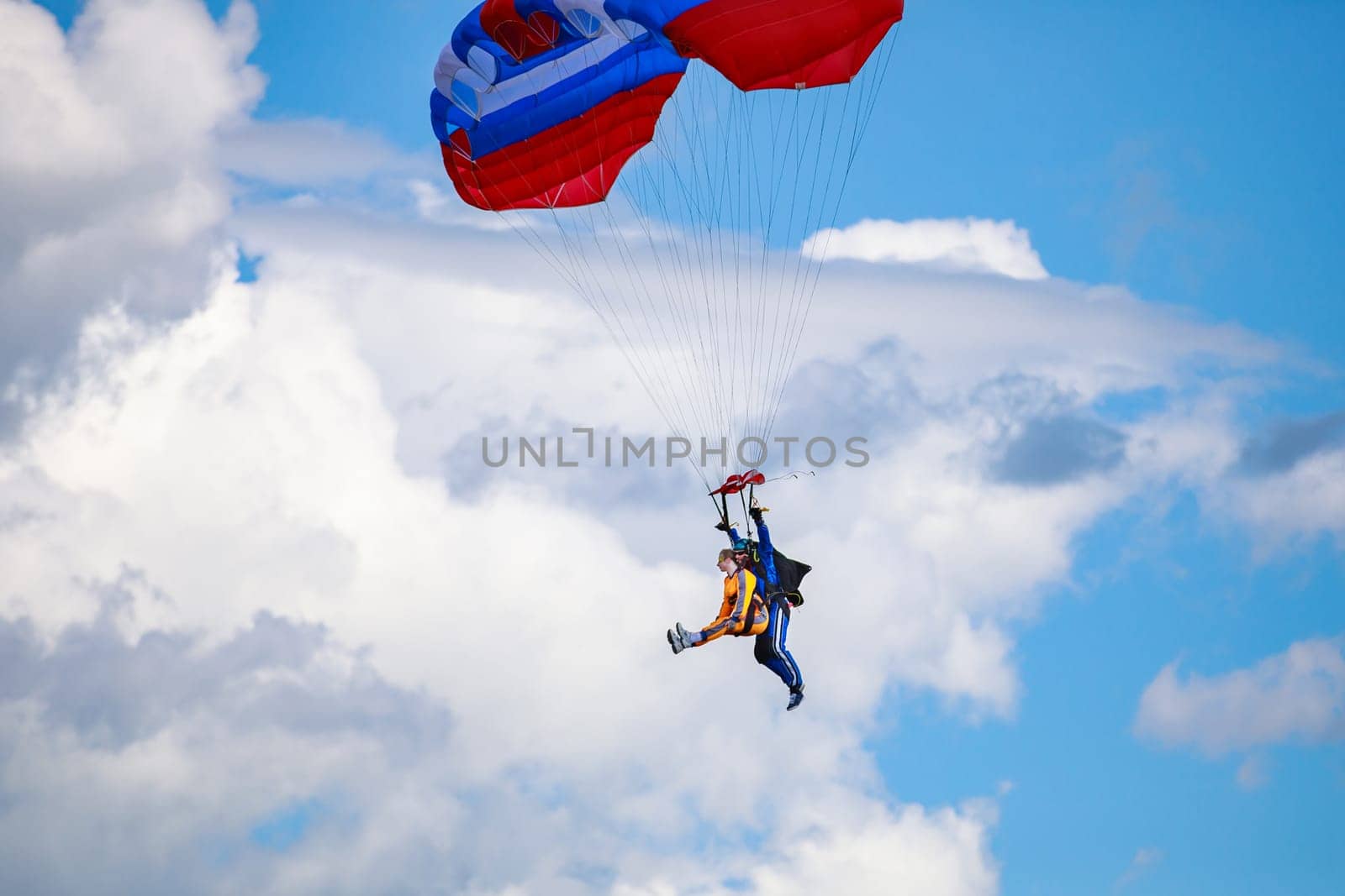 Kirzhach Russia July 22, 2023 Jump in tandem skydivers-athletes with a parachute. by Yurich32