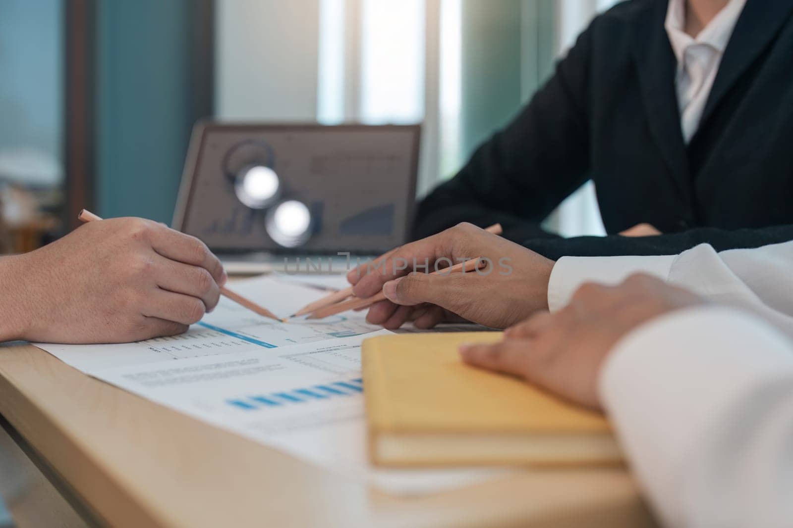 Asian business adviser meeting to analyze and discuss the situation on the financial report in the meeting room. Investment Consultant, Financial Consultant, Financial advisor and accounting concept.