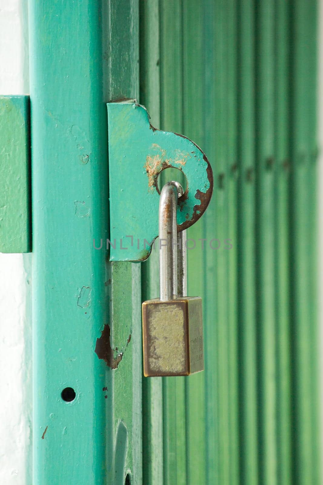 The lock key is on the steel door loop.