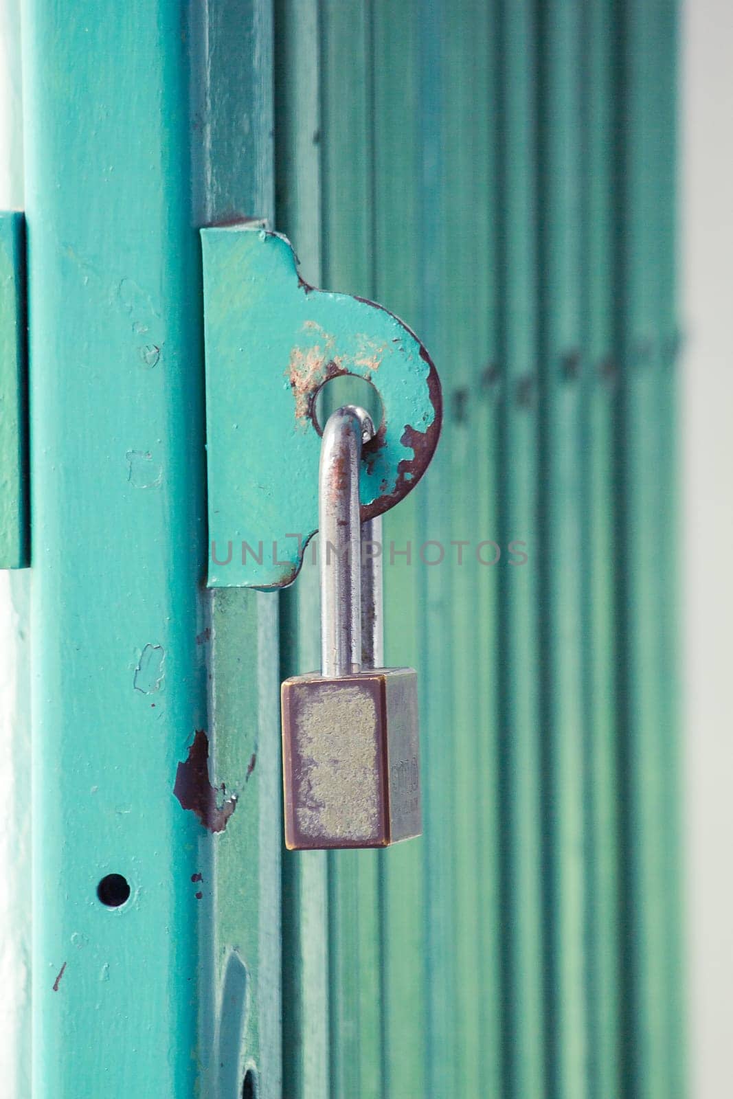 The lock key is on the steel door loop.