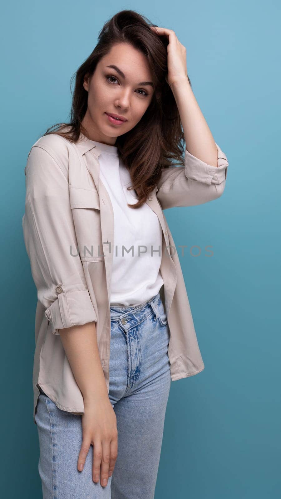 informal attractive 30s brunette woman dressed in a shirt flirting.