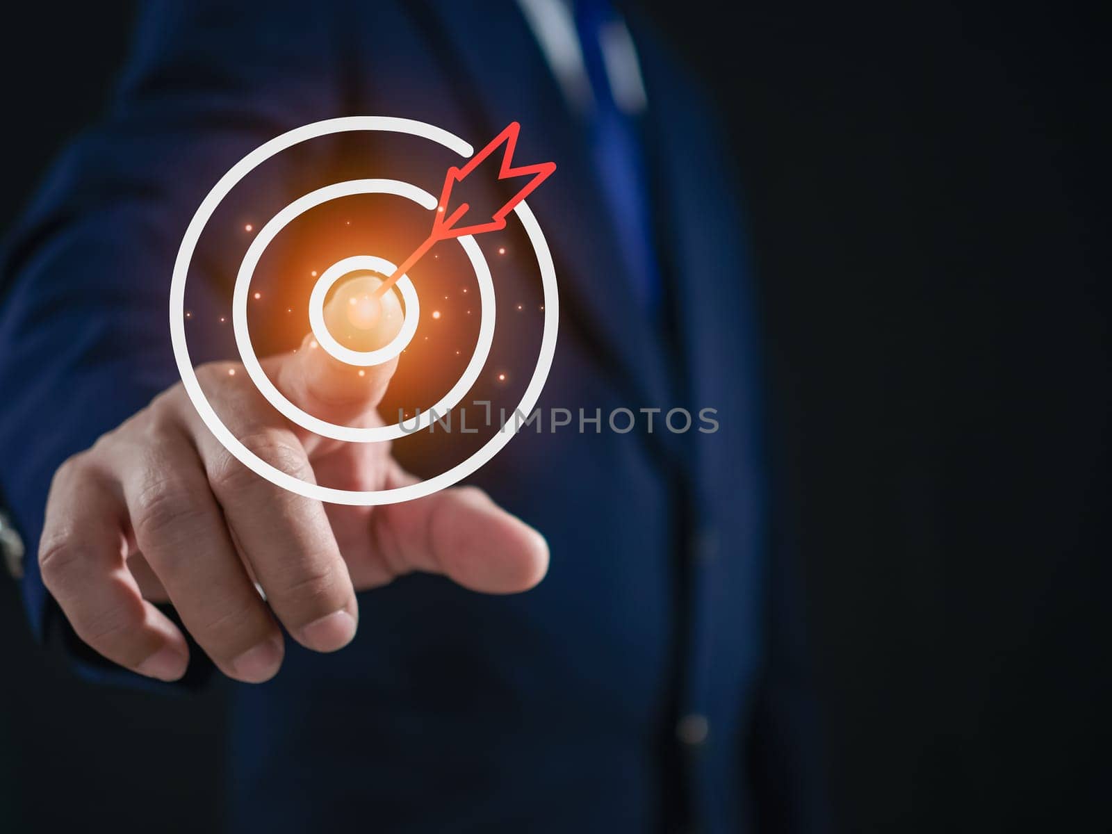 Businessman pointing to the target. Business concept. management concept business planning concept by Unimages2527