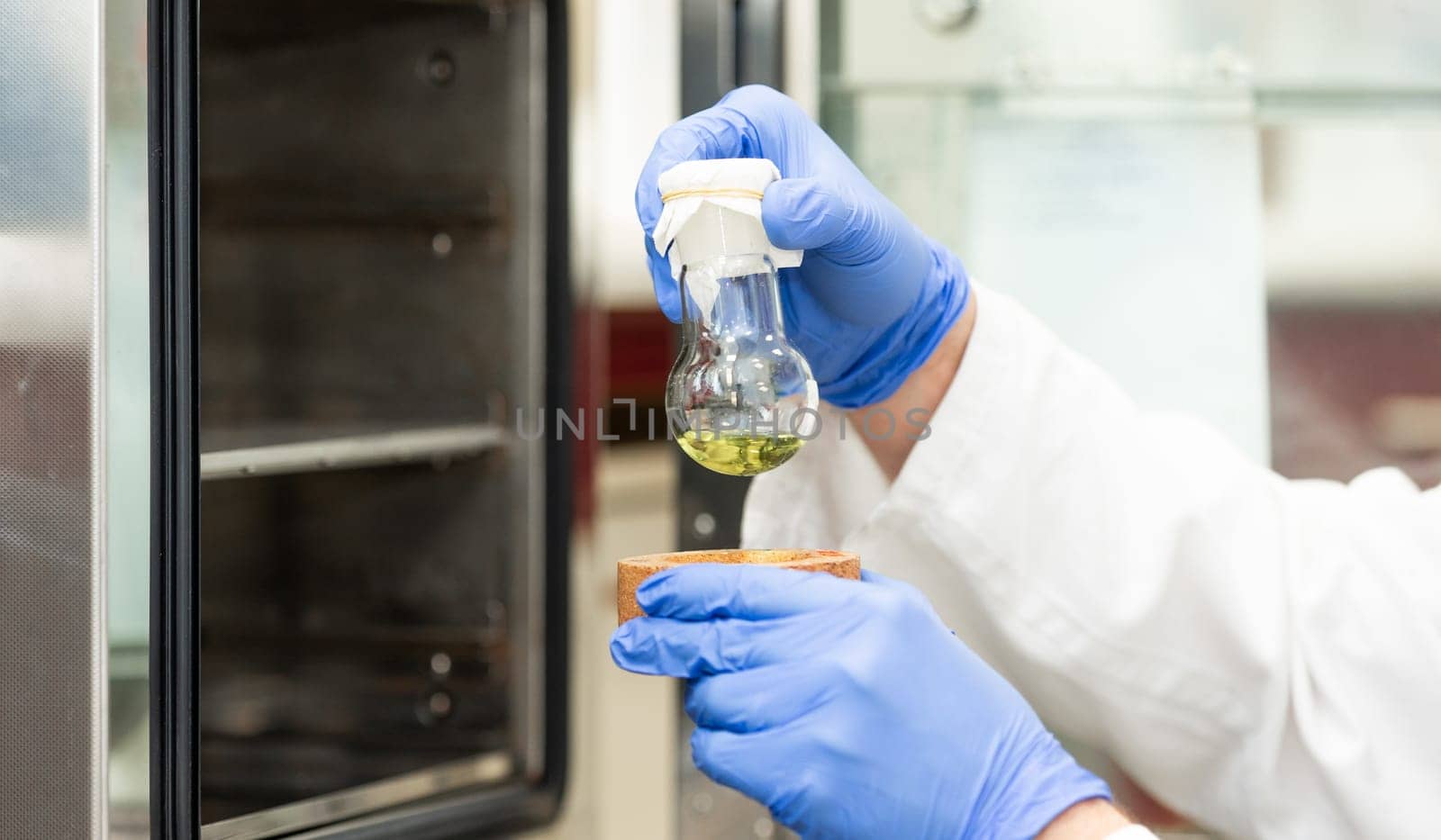 Young scientist in a research laboratory creating scientific experiment, laboratory concept