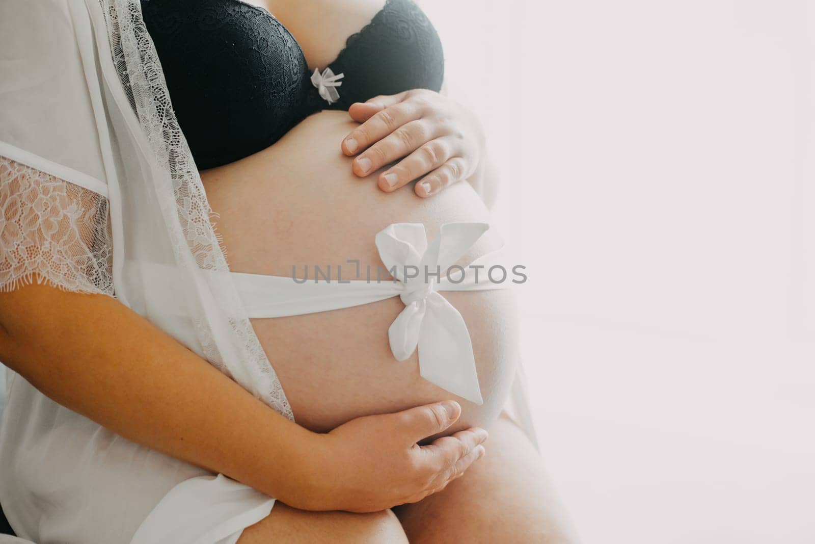 Young pregnant woman with belly, pregnancy concept by Kadula