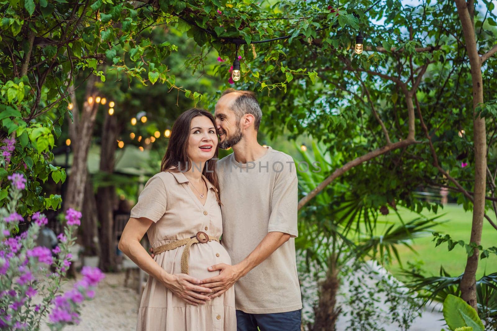 A blissful scene in the park as a radiant pregnant woman after 40 and her loving husband after 40, cherish the joy of parenthood together, surrounded by nature's serenity.