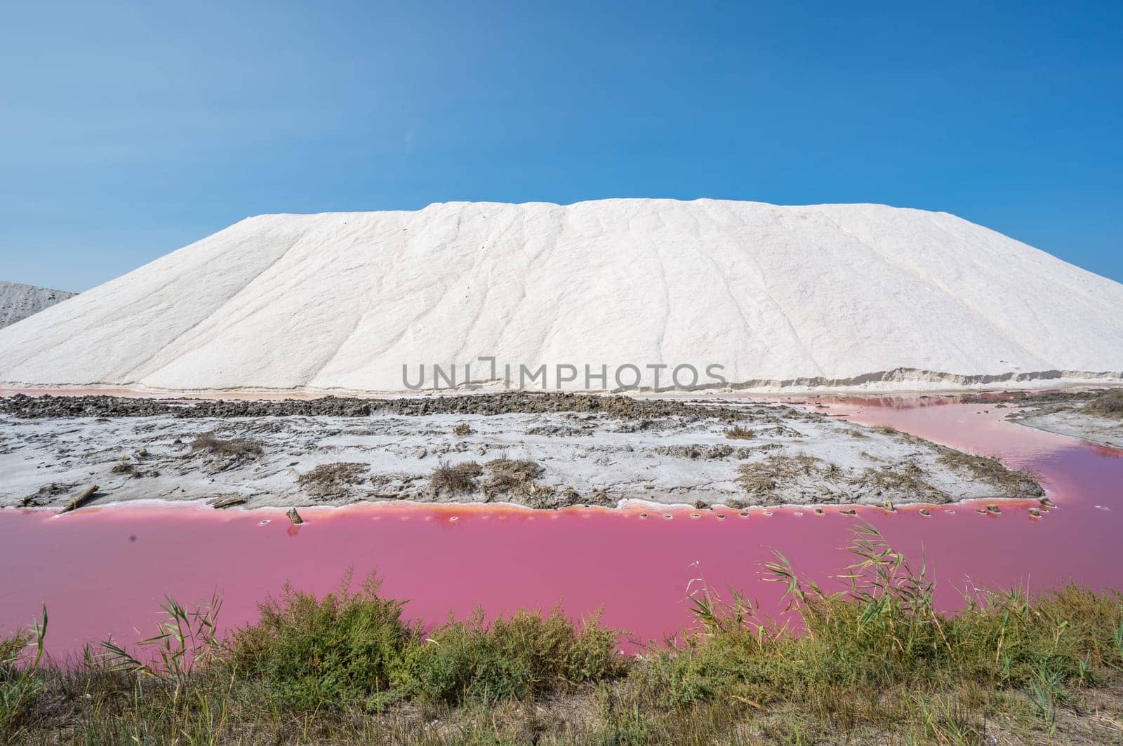 Pink Ponds In Man-made Salt Evaporation Pans In Camargue, Salin de Guiraud, France. High quality photo
