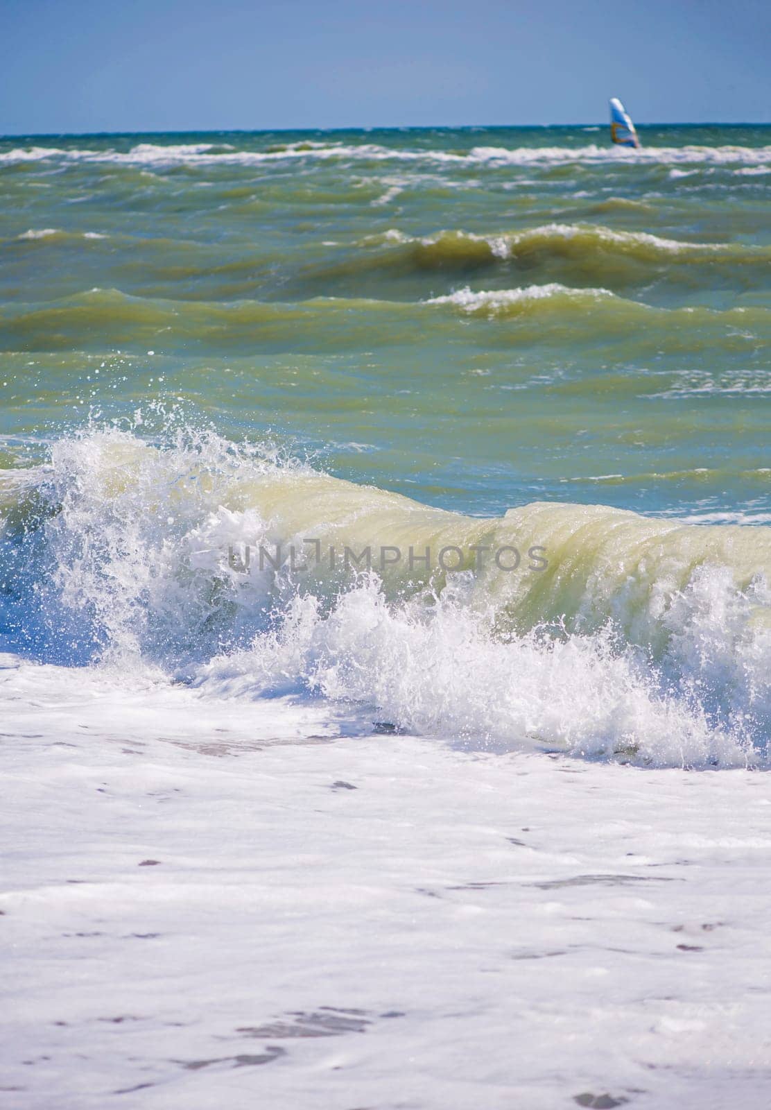 The sea is stormy. Sea of Azov. Water edge, sea, wave, storm - marine natural background. Birds seagulls on the sea coast, a beach by aprilphoto